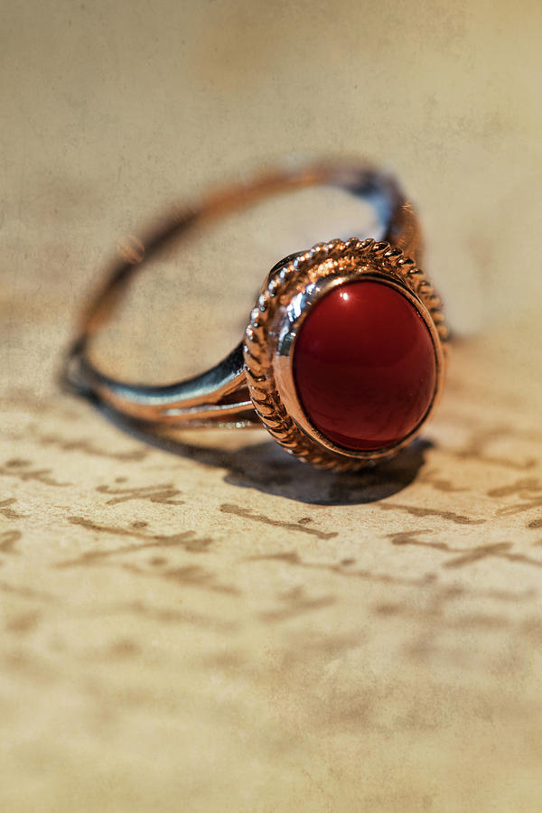 Shiny ring with dark red stone Photograph by Jaroslaw Blaminsky