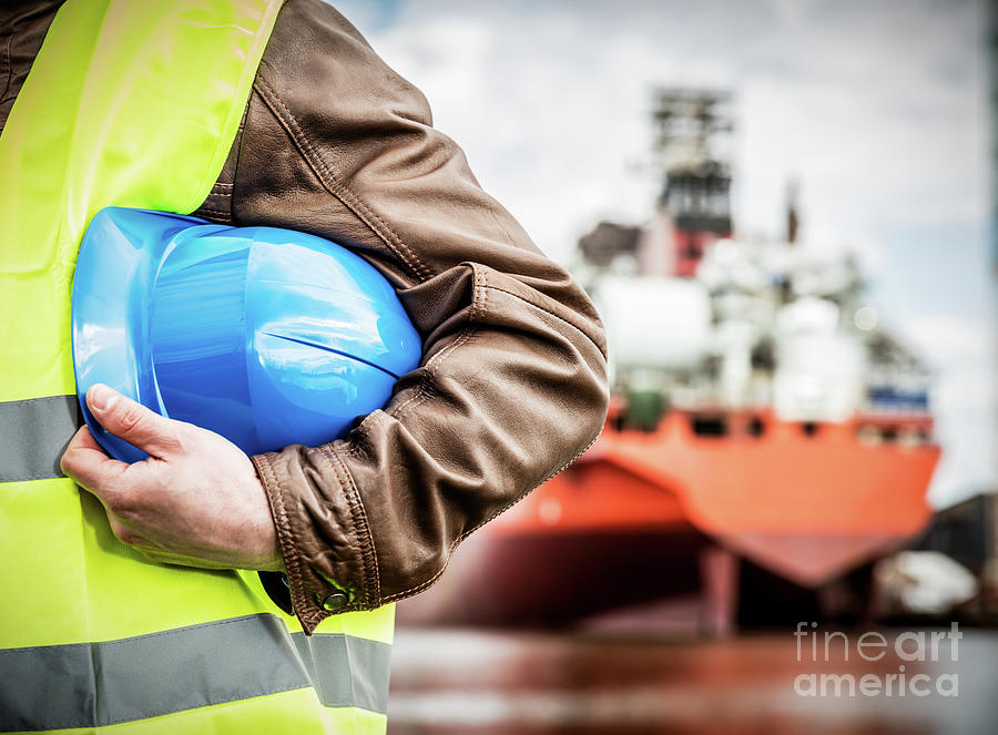 Shipbuilding engineer with safety helmet in shipyard Photograph by Michal Bednarek