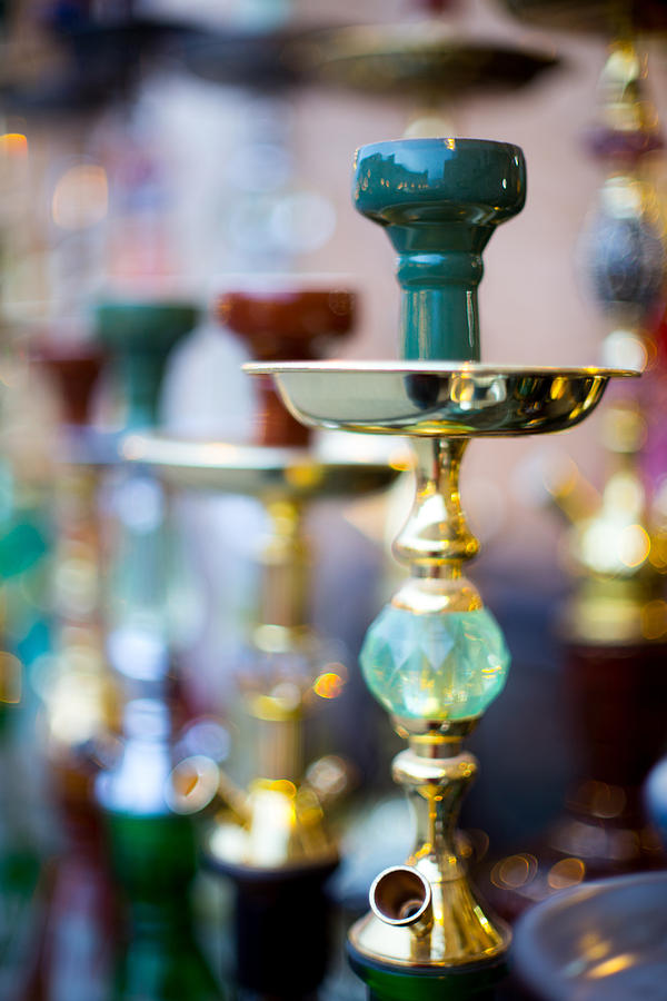 Shisha pipes lined up in a Doha Souq Photograph by Paul Cowan