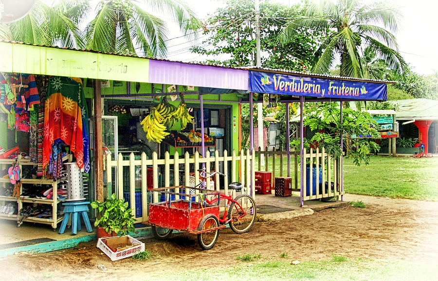 Shops in Tortuguero Village Photograph by Carolyn Derstine