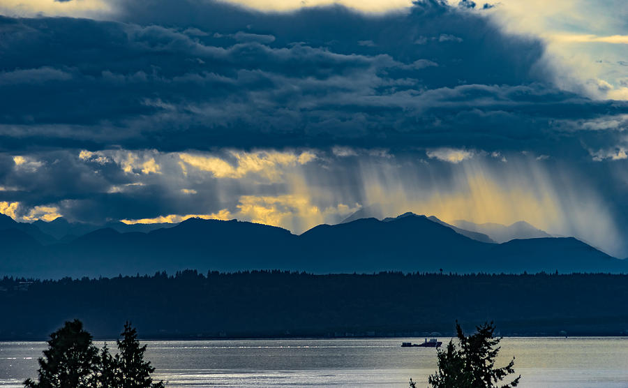 Showers and clouds over the Olympic Mountains Photograph by Tommy Farnsworth