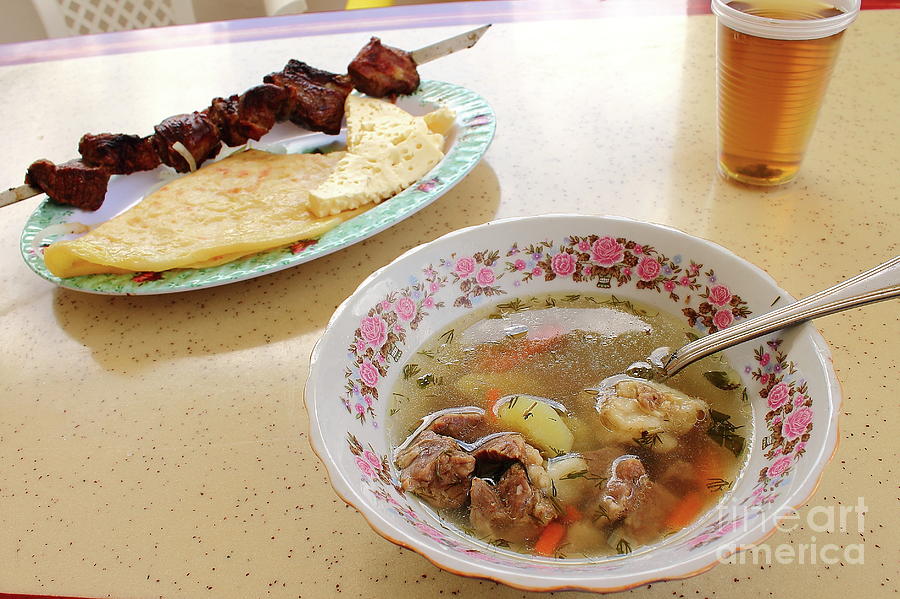Shurpa - A Traditional Soup With Lamb And Vegetables, Kebab, Hychiny And Goat Cheese With Tea. Photograph
