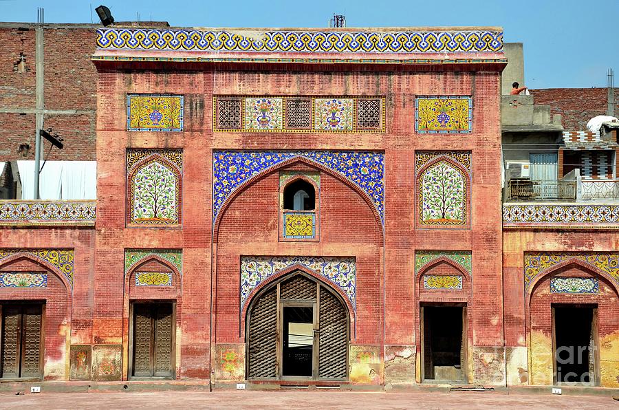 Side arch with kashikari frescoes and tiles Wazir Khan mosque Lahore Pakistan Photograph by Imran Ahmed