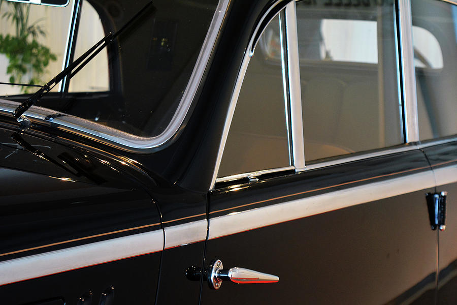 Side doors and windscreen of classic vintage black car Photograph by