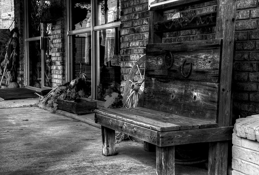 Sidewalk Wooden Bench in Black and White Photograph by Ester McGuire