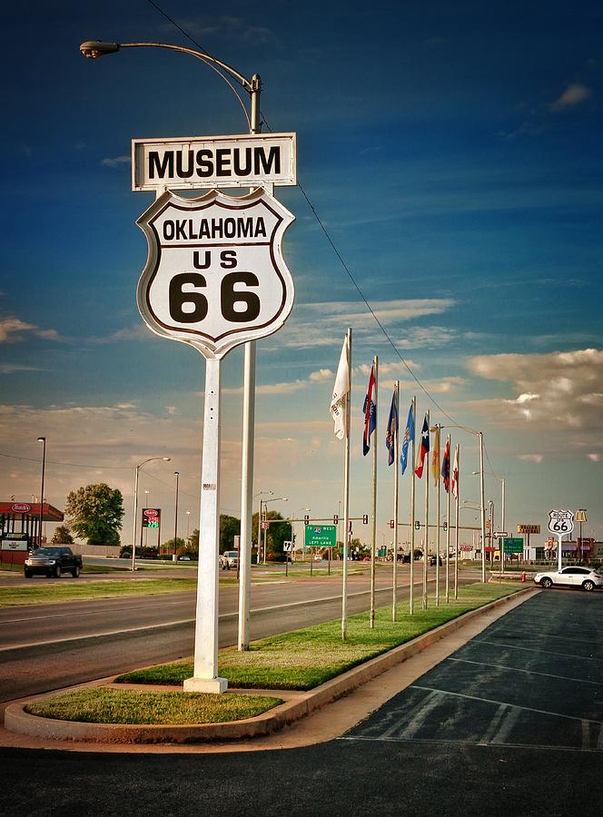 Sign and Flags at Oklahoma Route 66 Museum  Photograph by Buck Buchanan