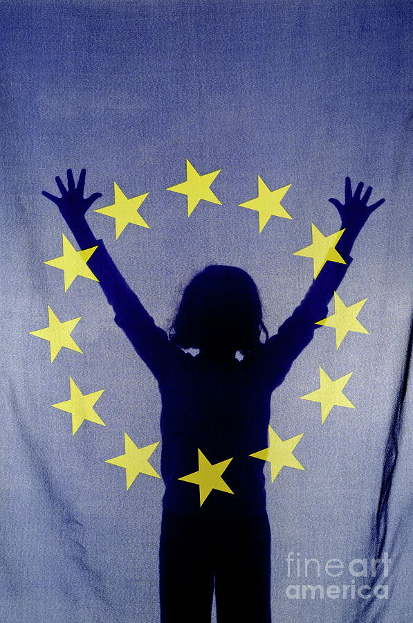 Silhouette of girl with arms raised behind European Union Flag Photograph by Sami Sarkis