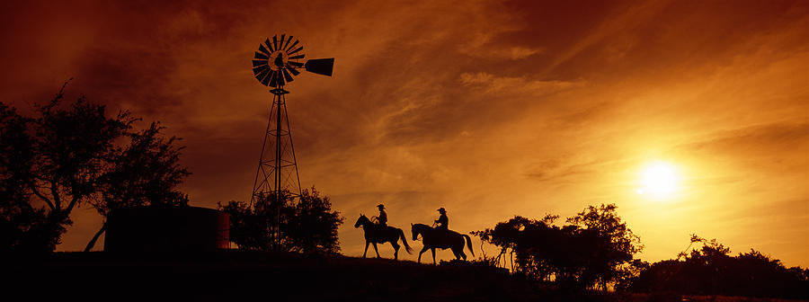 Sunset Photograph - Silhouette Of Two Horse Riders by Panoramic Images