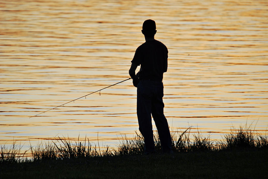 Silhouetted Fisherman Photograph by Teresa Blanton