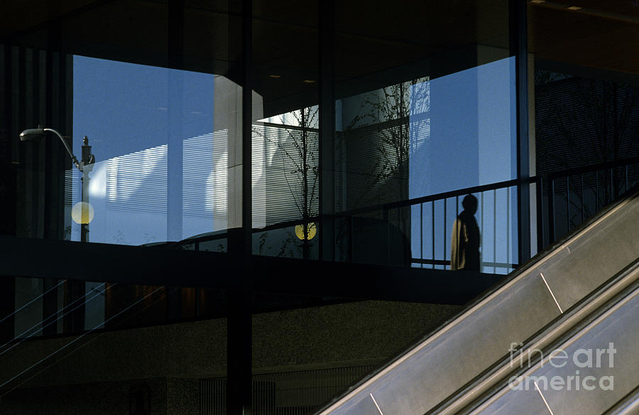 Silhouetted man in Business Complex  Photograph by Jim Corwin