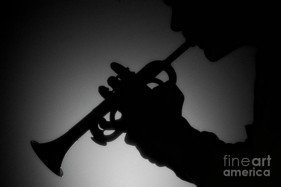 Silhouetted Man Playing Trumpet Photograph by Jim Corwin