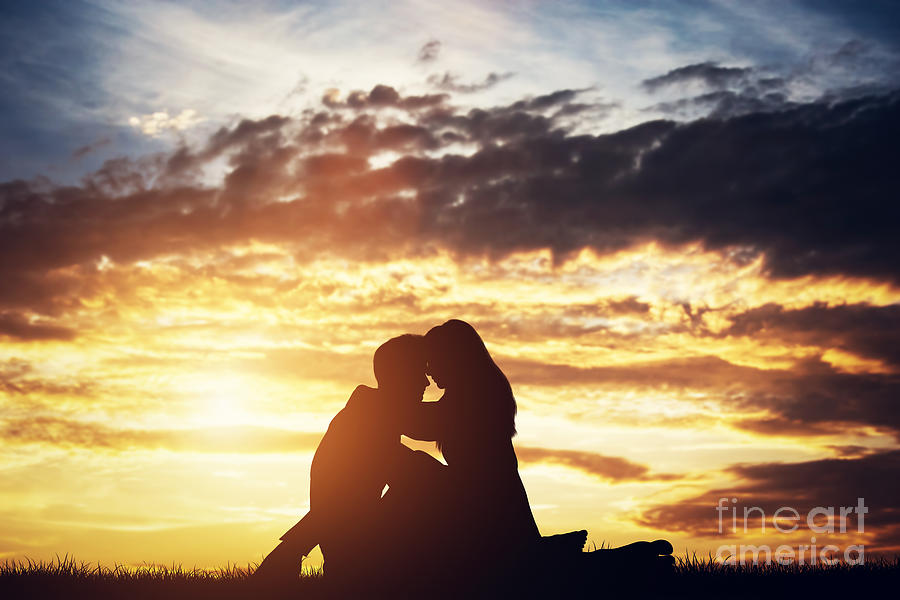 Silhouettes of a couple in love sitting and hugging Photograph by Michal Bednarek
