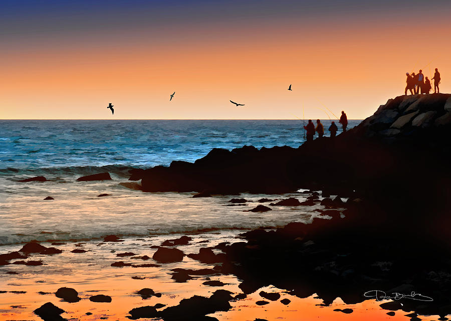 Silhouettes  Of People Fishing On Rocks With Orange And Blue Sky And Blue Ocean Photograph by Dan Barba
