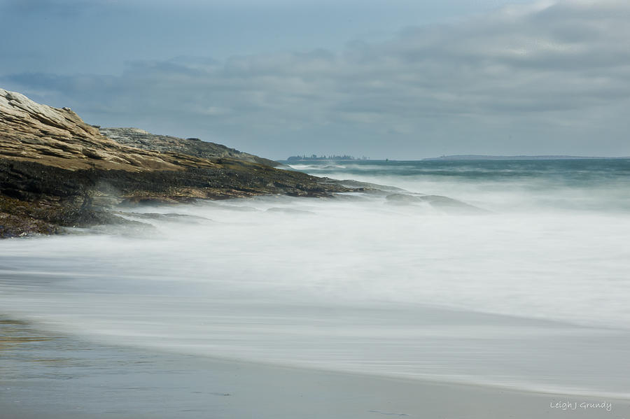 Silky surf against the rocky shoreline Photograph by Leigh Grundy