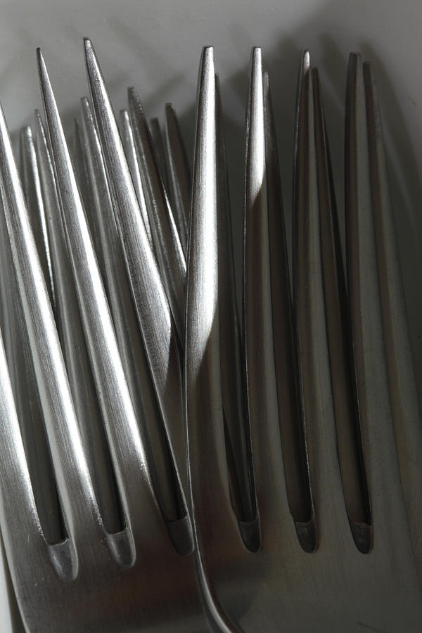 Silver forks in a kitchen drawer Photograph by Ulrich Kunst And Bettina Scheidulin