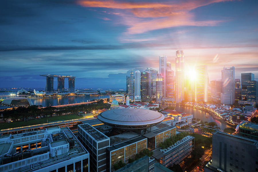 Singapore city with sunrise by day to night photo Photograph by Anek Suwannaphoom
