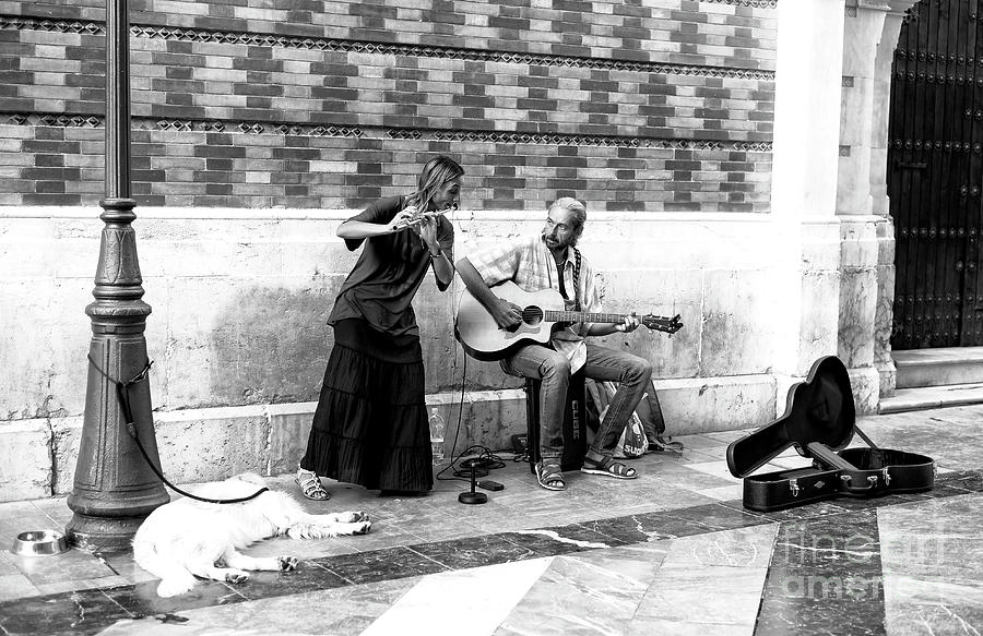 Singing for their Supper in Malaga Photograph by John Rizzuto