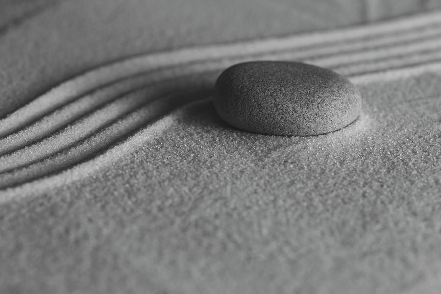 Single Meditation Stone on Flowing Sand Number 1 Black and White Photograph by Andrew Pacheco