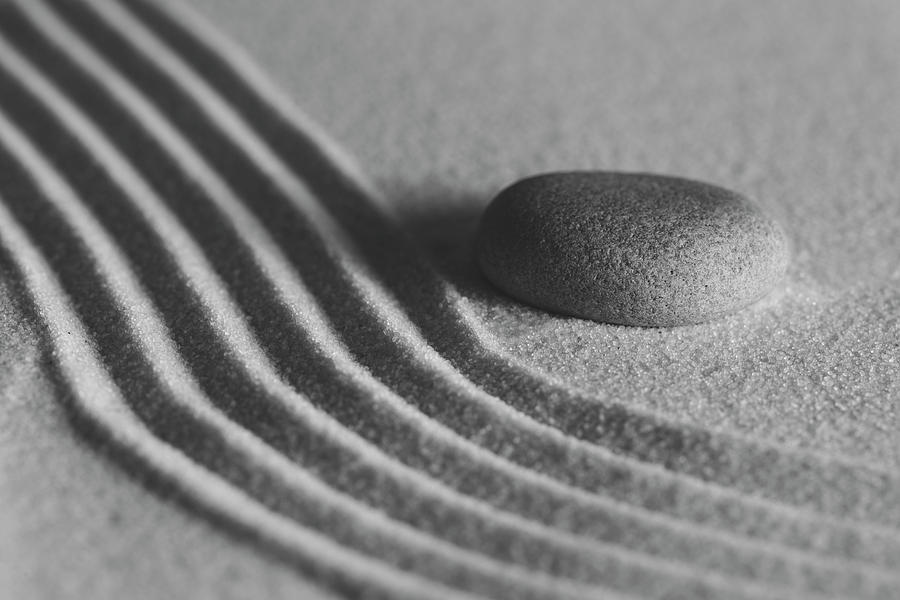 Single Meditation Stone on Flowing Sand Number 2 Black and White Photograph by Andrew Pacheco