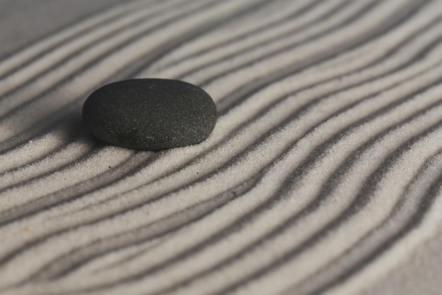 Single Meditation Stone on Flowing Waves of Sand Color Photograph by Andrew Pacheco