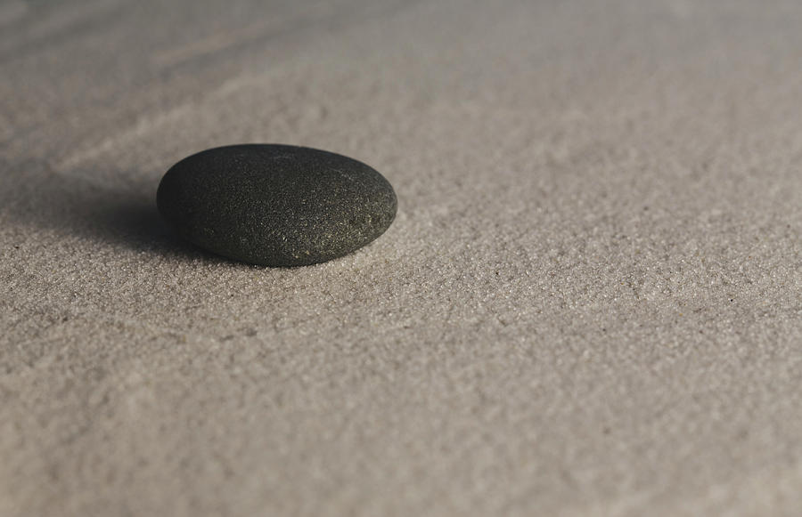 Single Meditation Stone on Smooth Sand Color Photograph by Andrew Pacheco