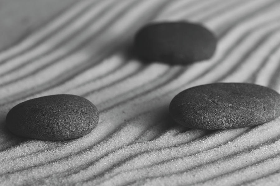 Single Meditation Stones on Flowing Sand Black and White Photograph by Andrew Pacheco