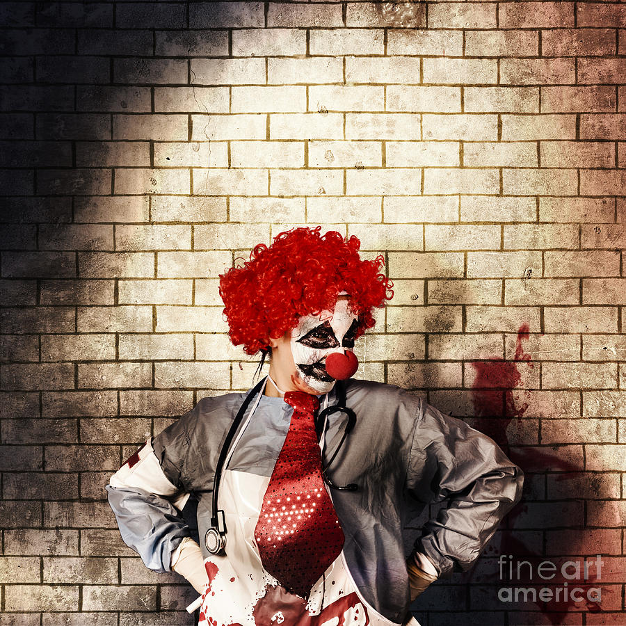 Halloween Photograph - Sinister gothic clown standing on grunge brickwall by Jorgo Photography