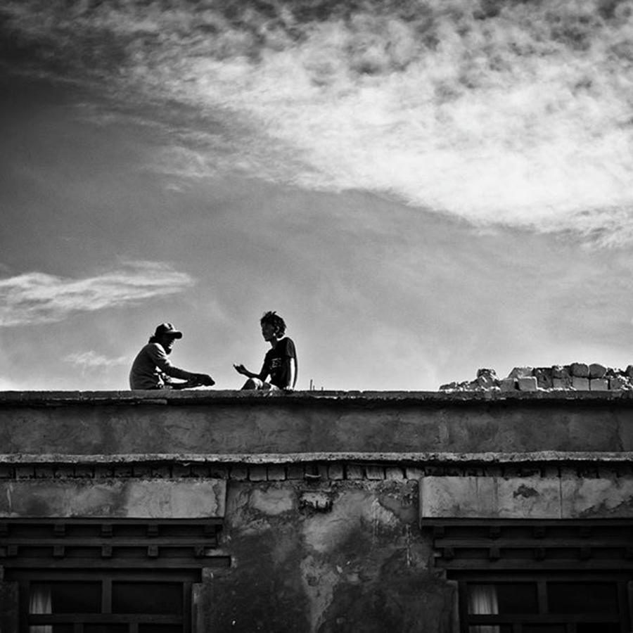 Travel Photograph - Sitting On The Roof Having A Chat, India by Aleck Cartwright