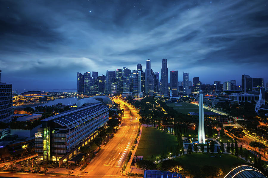 Sityscape of Singapore city on night  Photograph by Anek Suwannaphoom