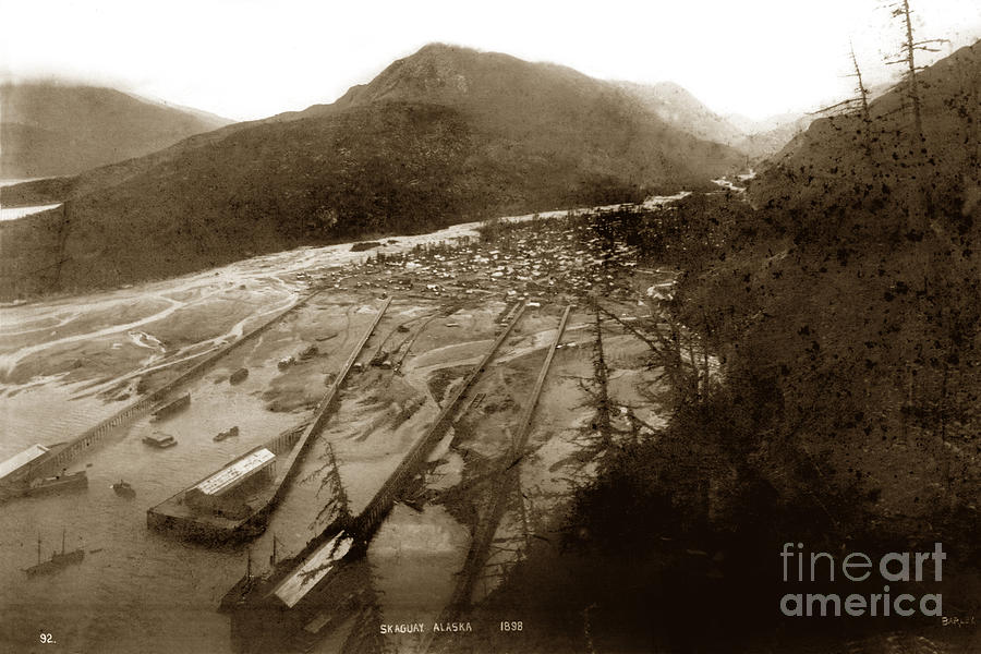 Pier Photograph - Skaguway, Alaska view from hill over looking 1898 by Monterey County Historical Society