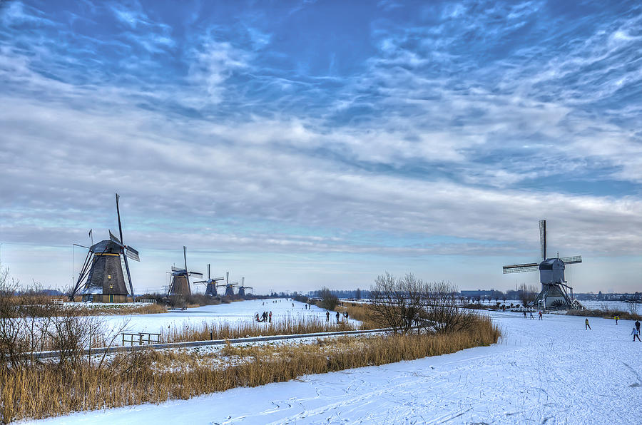 Skating around the Windmills Photograph by Frans Blok