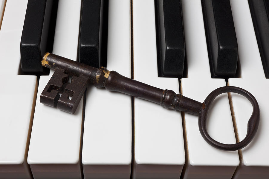 Key Photograph - Skeleton key on piano keys by Garry Gay
