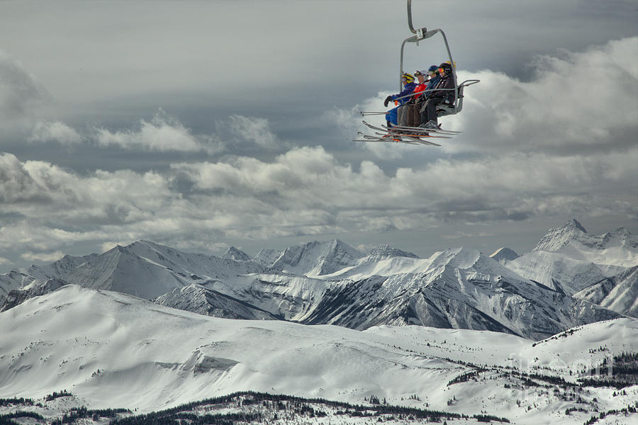 Skiers Above The Canadian Rockies Photograph by Adam Jewell