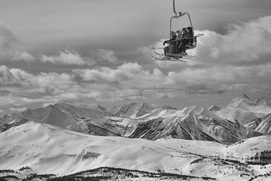 Skiers Above The Canadian Rockies Black And White Photograph by Adam Jewell