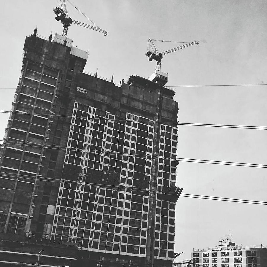 Crane Photograph - Skyscraper Under Construction by Sirikorn Techatraibhop
