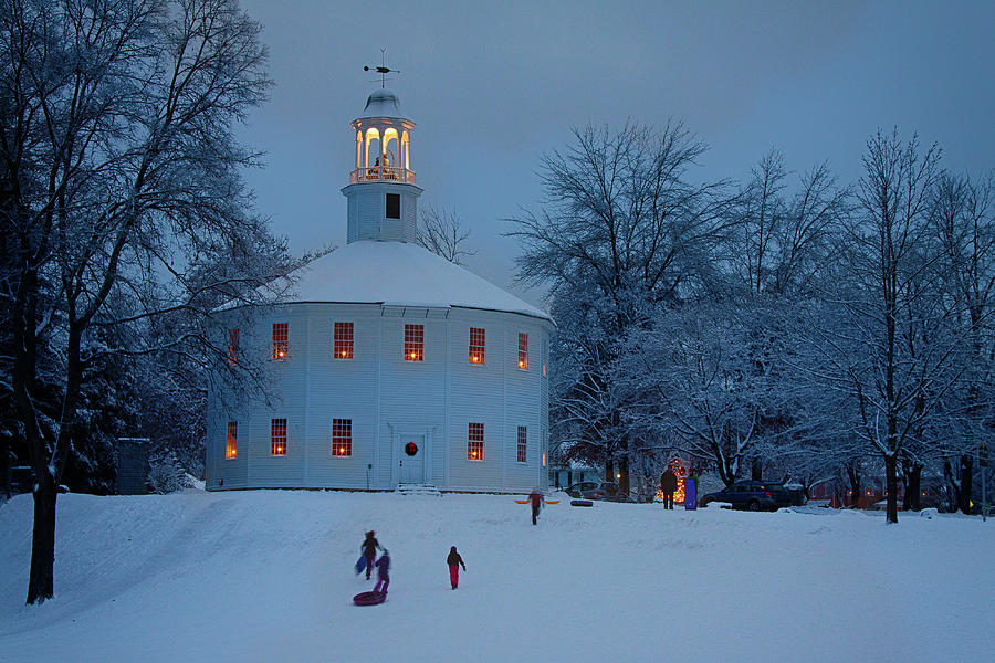Sledding at the Richmond Vermont church Photograph by Jeff Folger