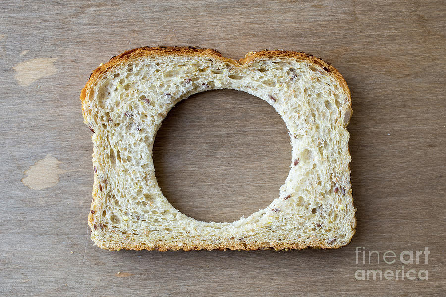 Bread Photograph - Slice of bread with missing center by Edward Fielding