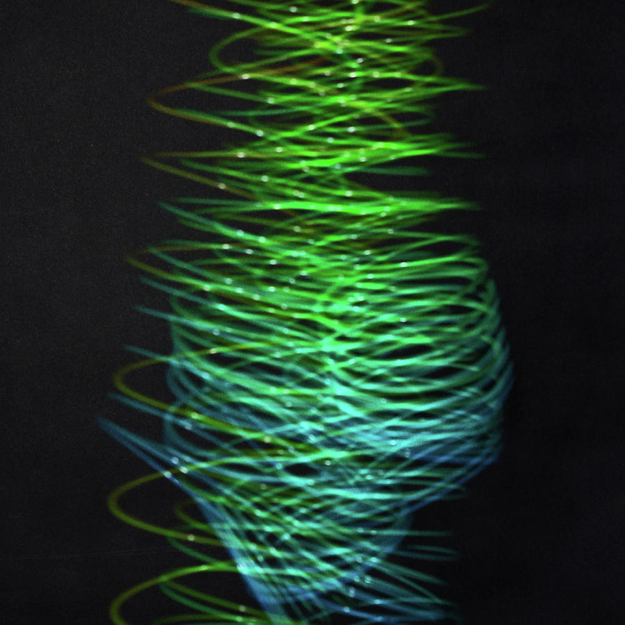 Slinky in Motion Photograph by Ira Marcus