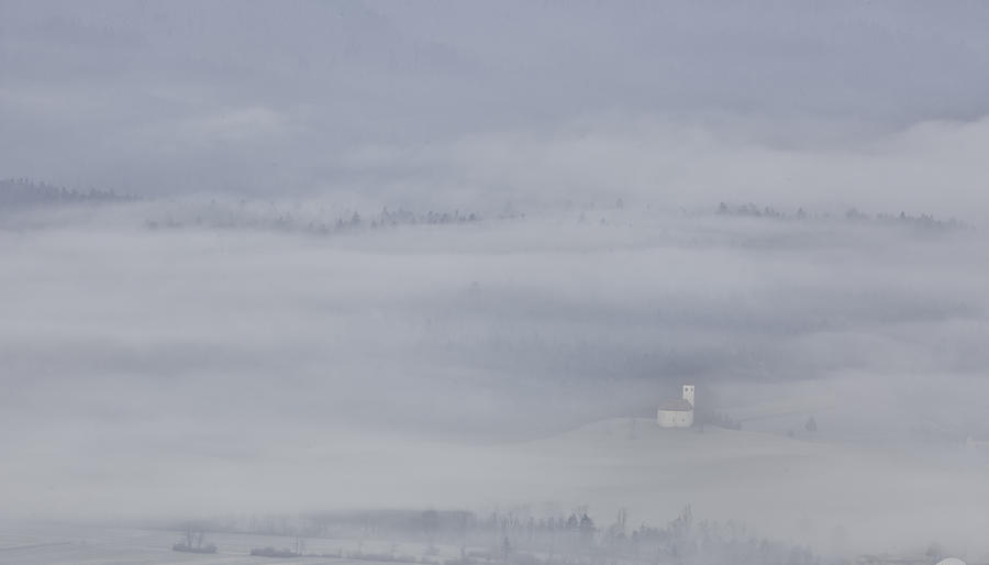 Slovenian church in the mist. Photograph by Dirk Ercken