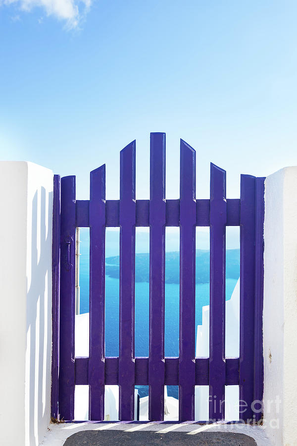 Small blue fence gate in Oia on Santorini island, Greece. Photograph by Michal Bednarek