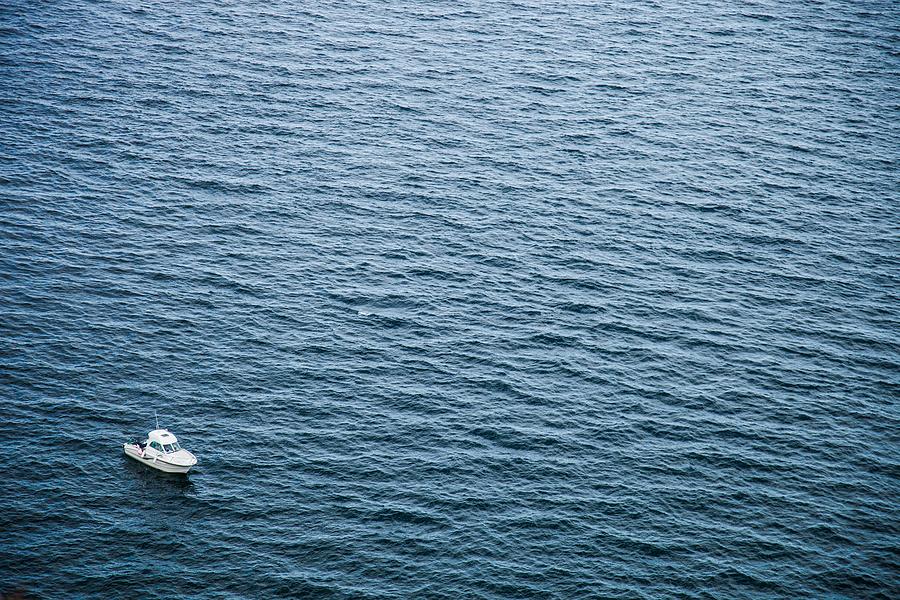 Small boat immerse in the beautiful Atlantic Ocean by Leonardo Patrizi