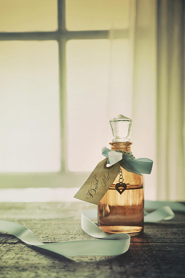 Small bottle with ribbon and tag Photograph by Sandra Cunningham