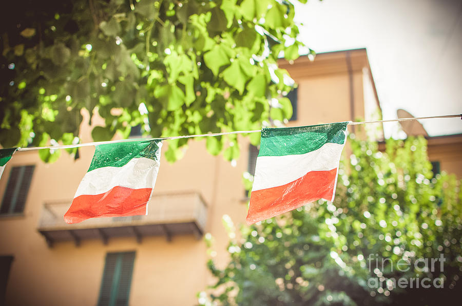 Flag Photograph - small Italian flags hanging by a thread by Luca Lorenzelli