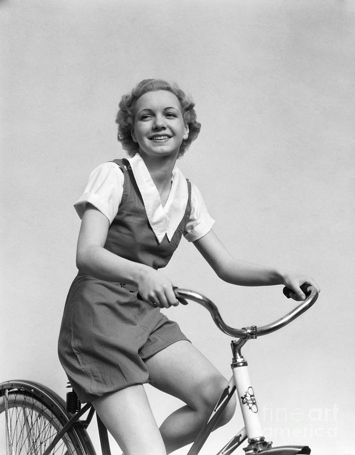 Smiling Blonde Woman Riding Bicycle Photograph by H. Armstrong Roberts/ClassicStock