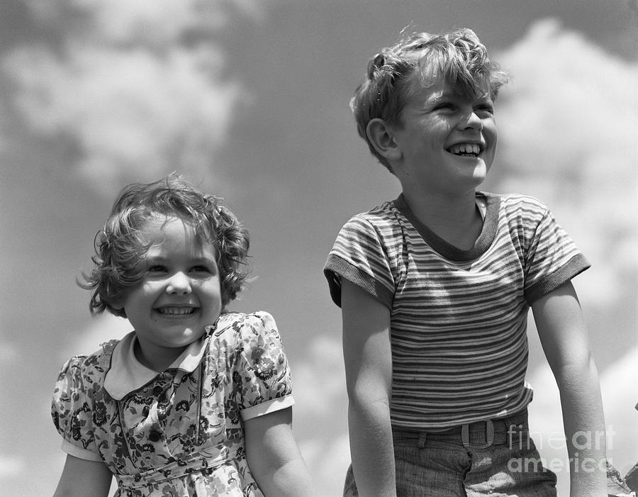 Smiling Boy And Girl, C.1930s Photograph by H. Armstrong Roberts/ClassicStock