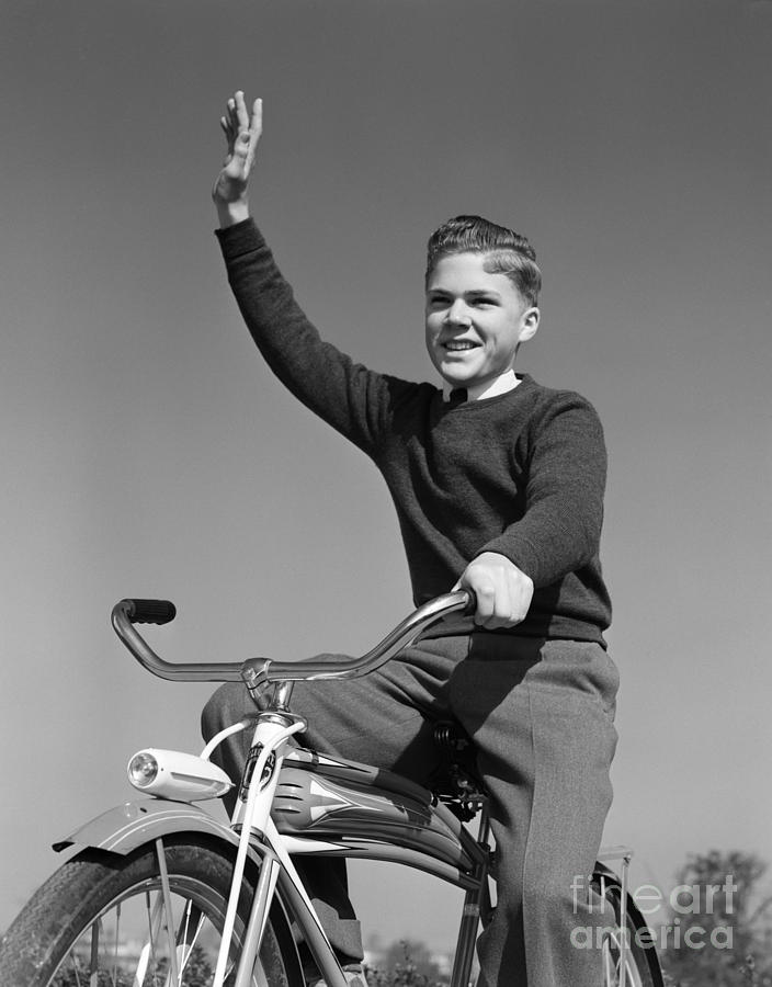 Smiling Boy On Bike Waving Arm Photograph by H. Armstrong Roberts/ClassicStock