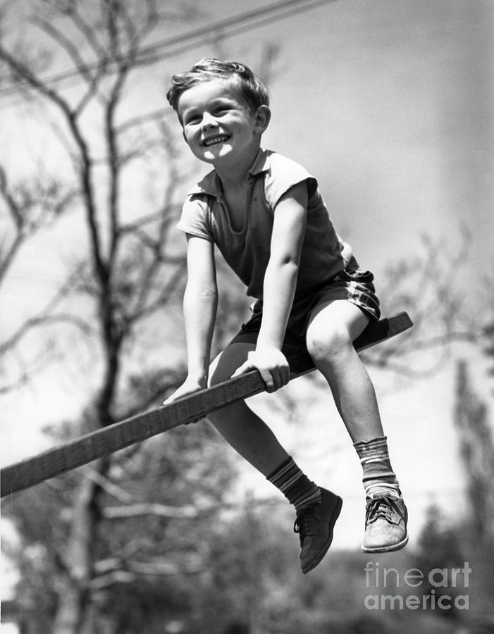 Smiling Boy On Seesaw, C.1930s Photograph by H. Armstrong Roberts/ClassicStock