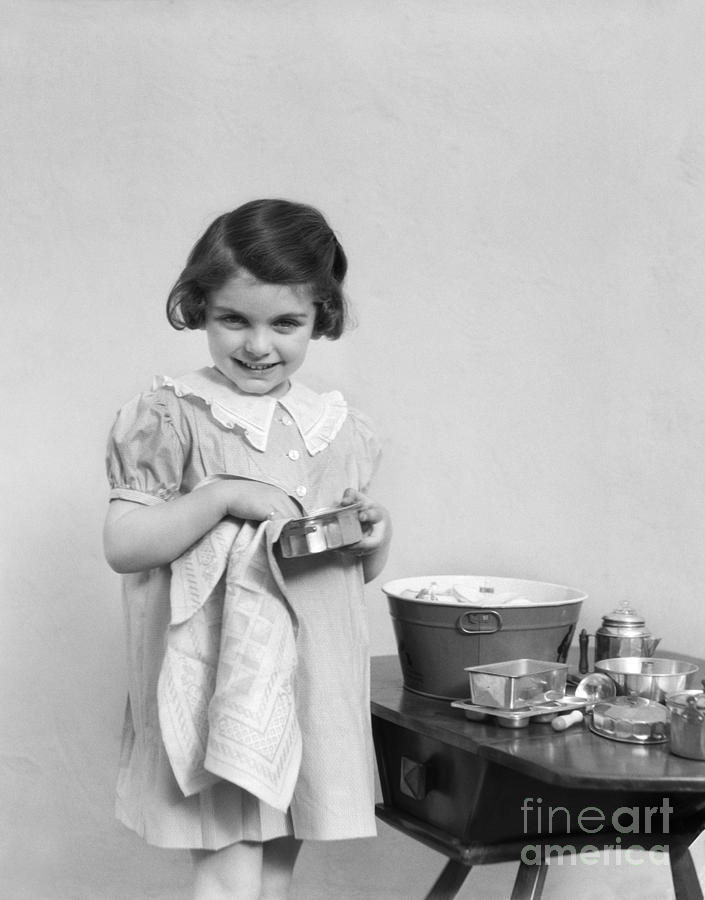 Smiling Girl Drying Toy Pots, C.1930-40s Photograph by H. Armstrong Roberts/ClassicStock