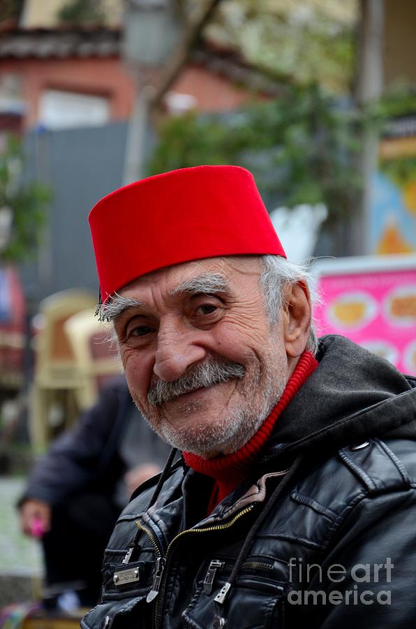 Turkey Photograph - Smiling happy old Turkish senior man in fez and leather jacket by Imran Ahmed