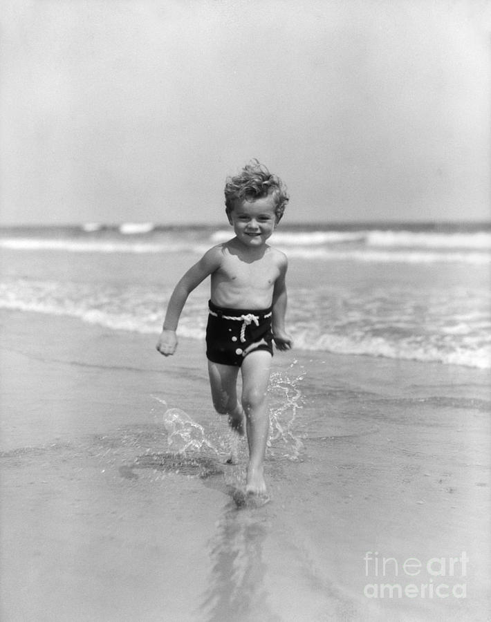 Summer Photograph - Smiling Little Boy Running In Surf by H. Armstrong Roberts/ClassicStock